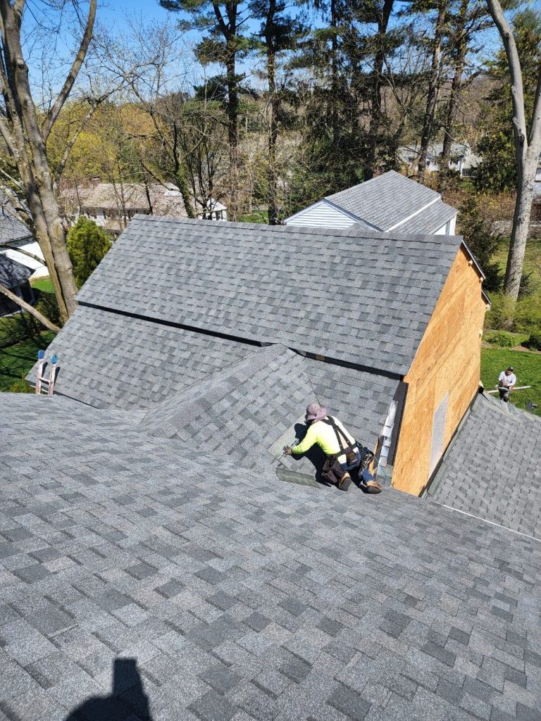 New roofing being installed over a prepared deck