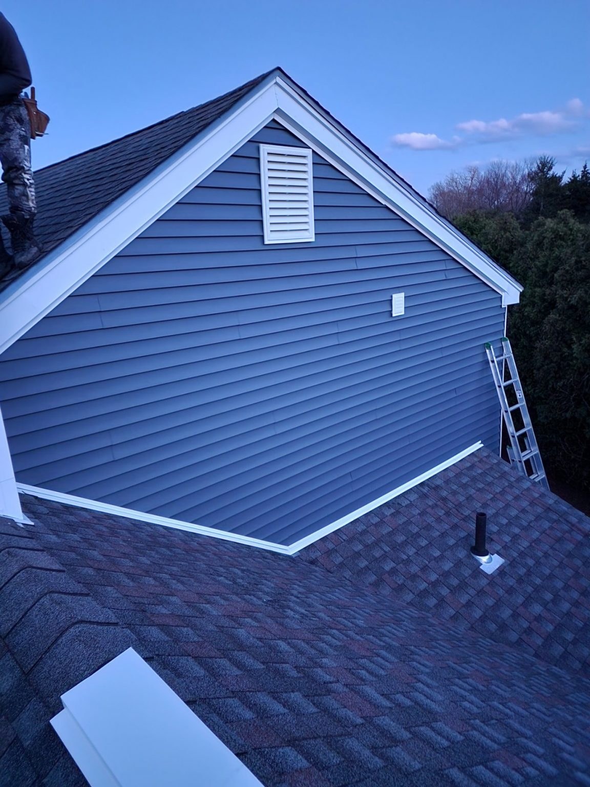 Blue siding and a new roof on a Connecticut home