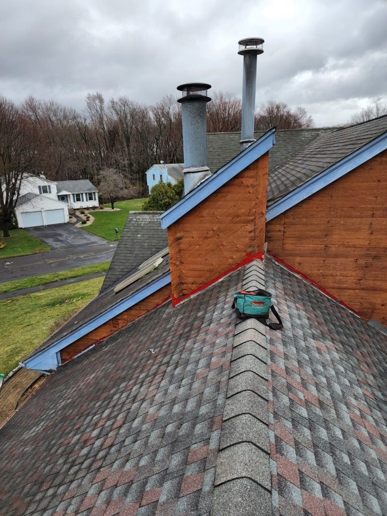 A roof valley and chimney on a Connecticut home
