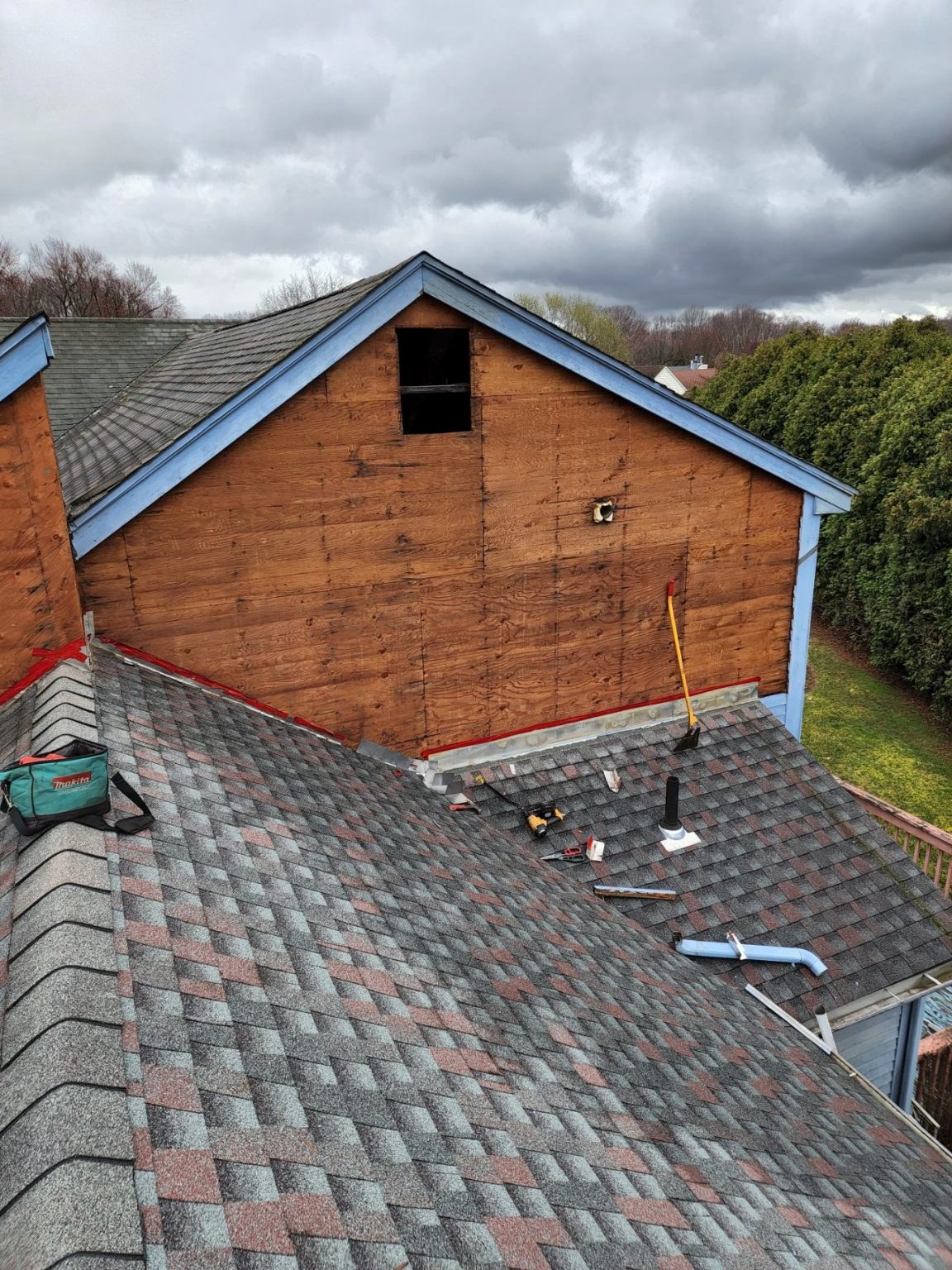 Siding and roofing work on a Connecticut building