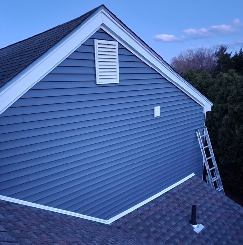 Blue siding and a new roof on a Connecticut home